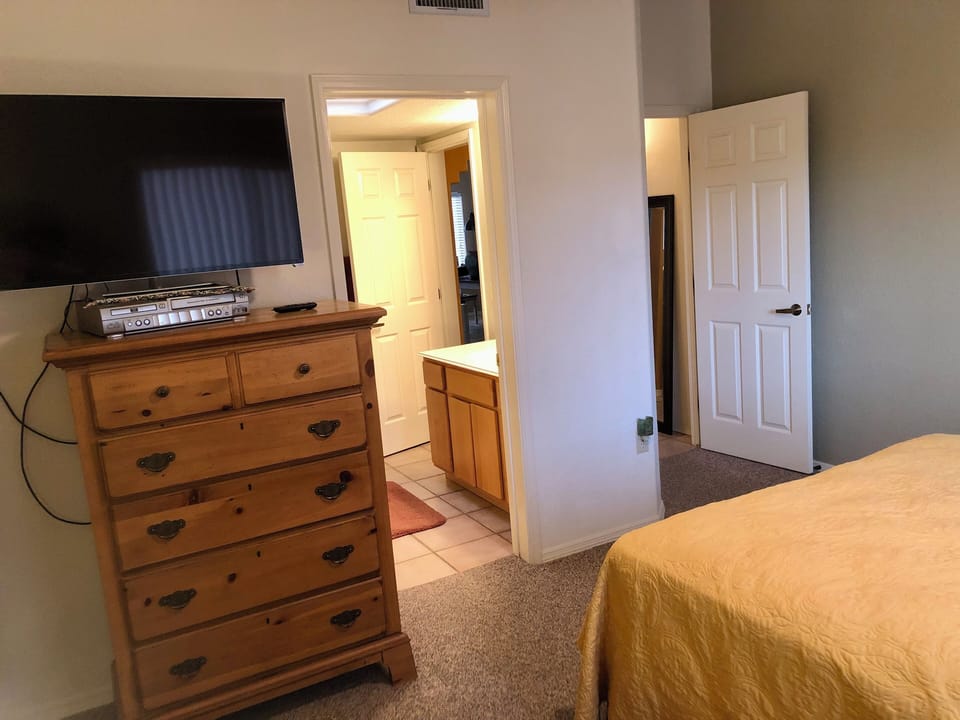 2nd Bedroom view of shared bathroom and entrance on right