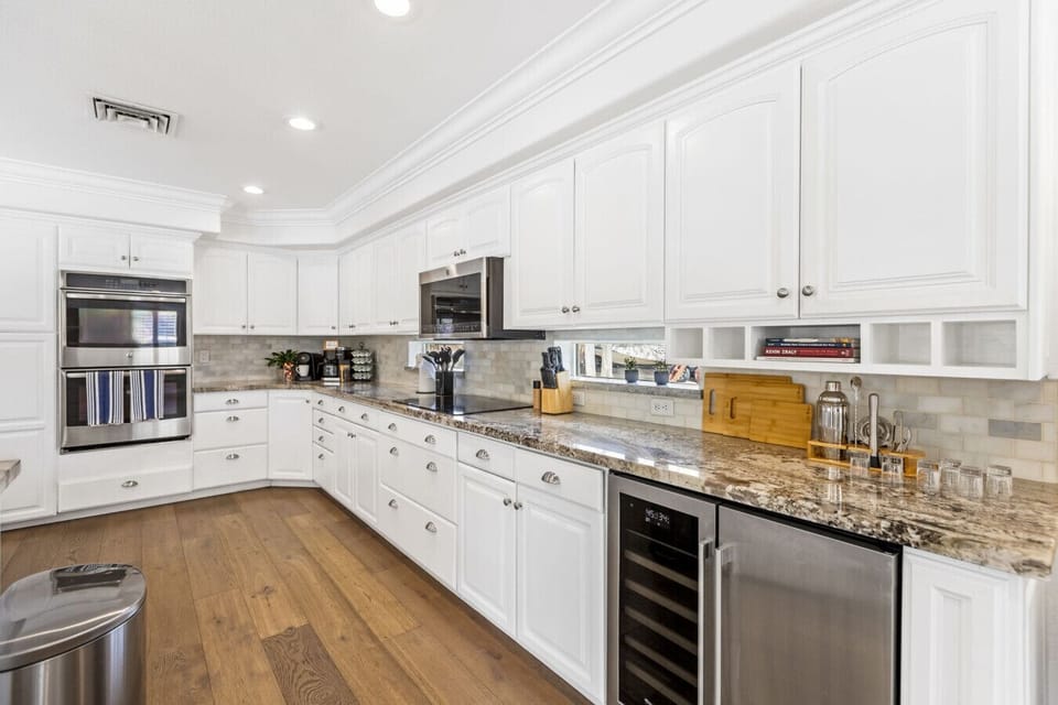 Gourmet Kitchen: Unleash your culinary skills in this chic kitchen with granite and top-tier appliances.