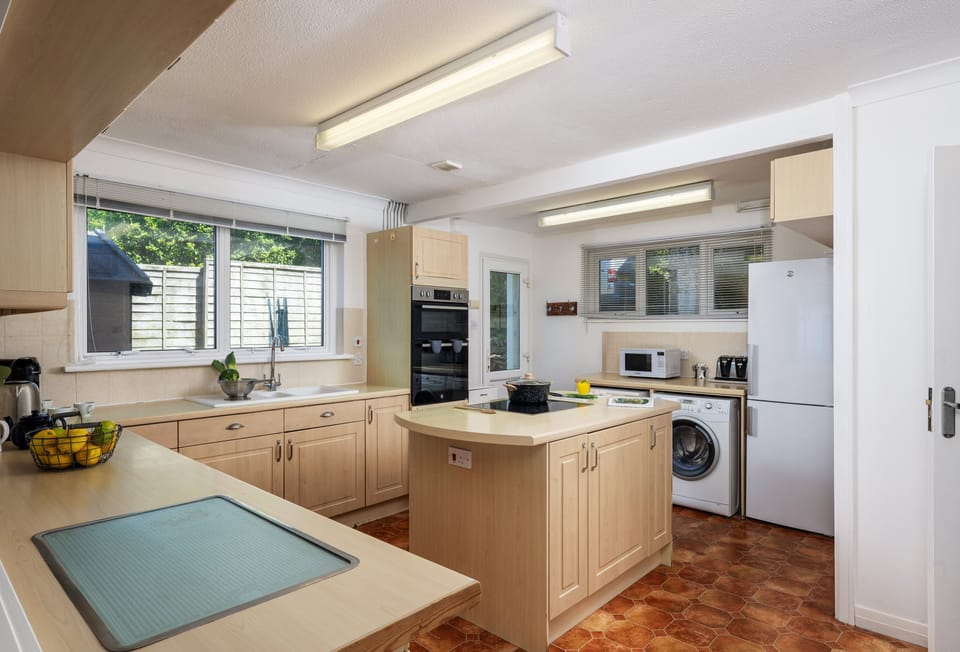 Boskenna, Tintagel: Kitchen with electric oven and induction hob, dishwasher, washing machine, tumble dryer, microwave and fridge/freezer.