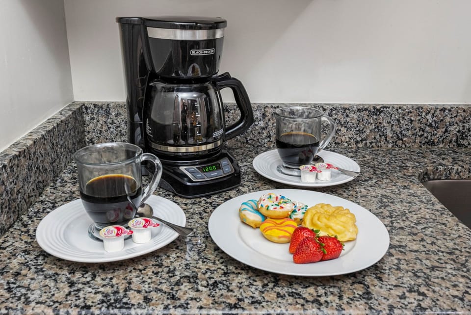 Kick off your day with a fresh cup from the Keurig-style coffee maker, with pods conveniently provided.
