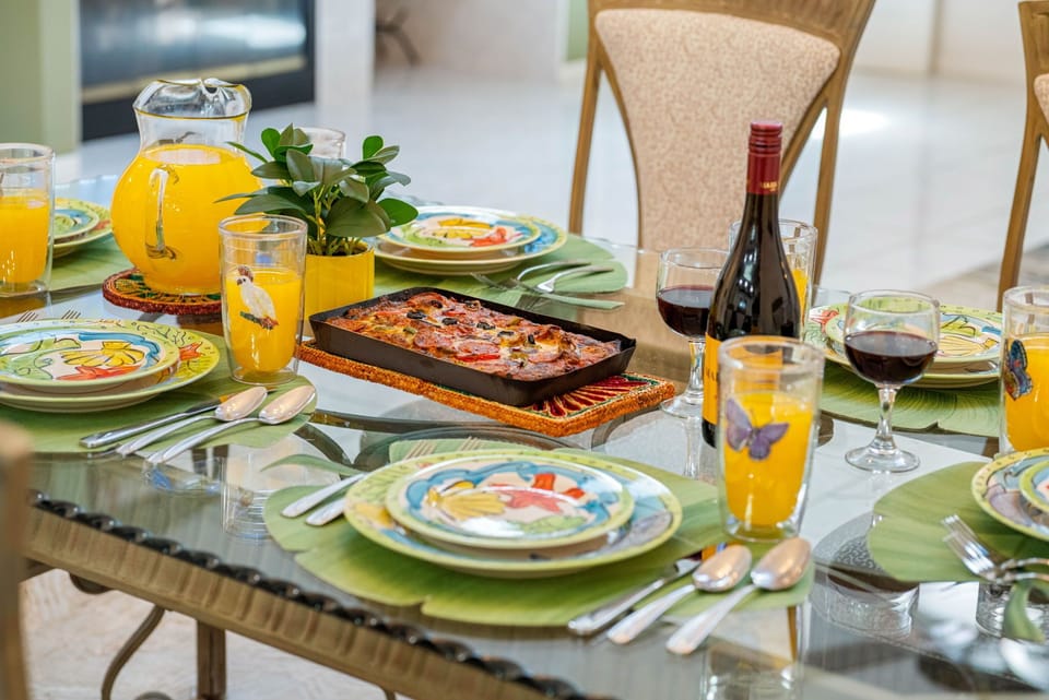 The dining area exudes a warm, inviting ambiance with a classic yet vibrant aesthetic.