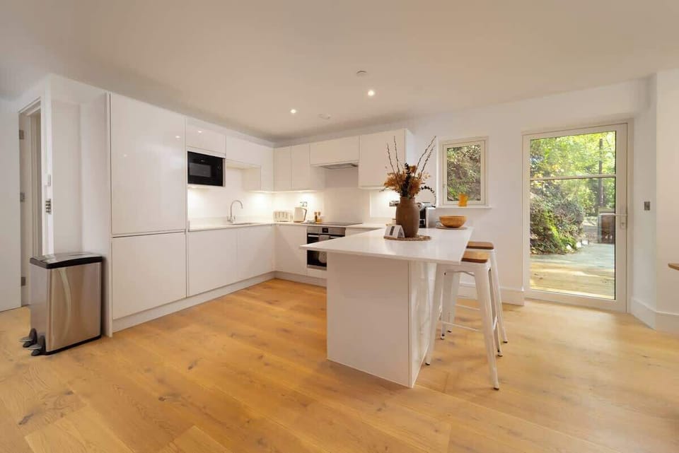 Experience a sleek, modern kitchen fully equipped with everything you need for a comfortable and effortless stay.