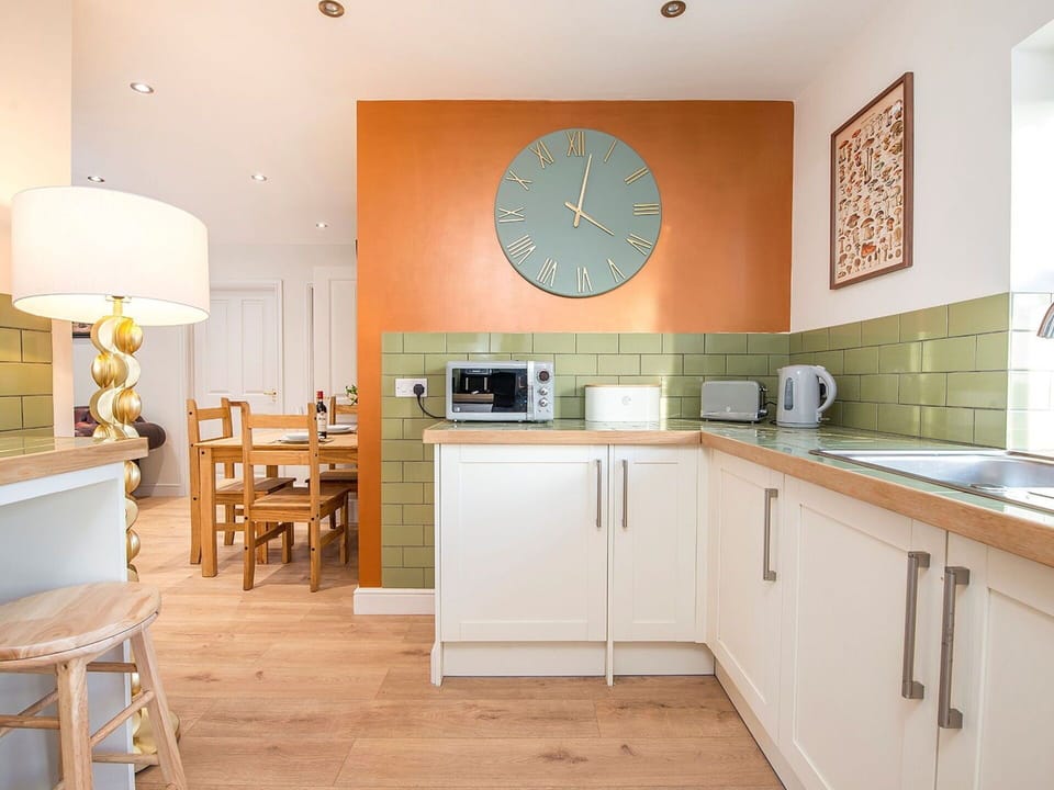 Furniture, Interior Design, Flooring, Wall, Kitchen, Countertop, Wood, Floor, Cabinetry, Kitchen Appliance