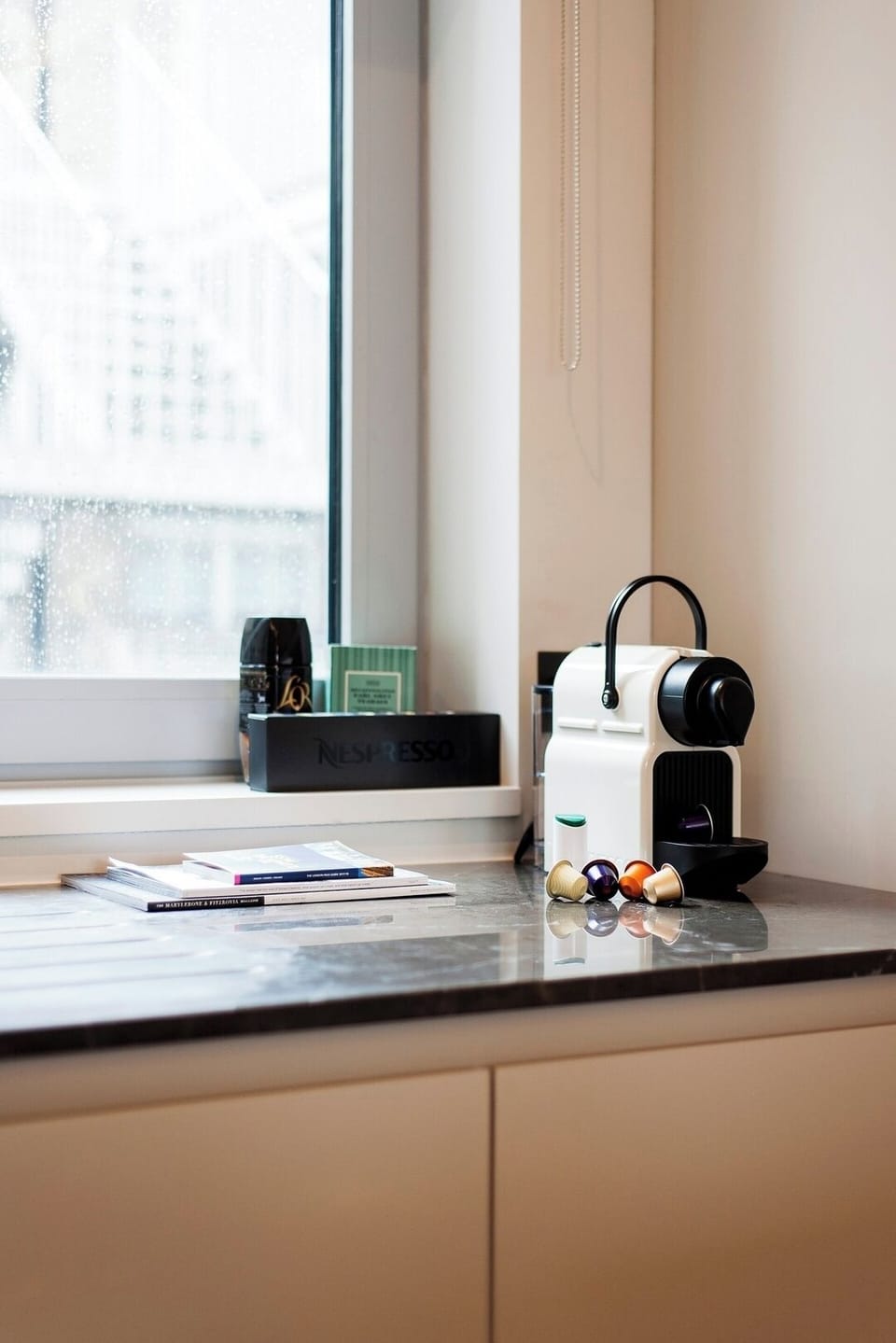 Enjoy a coffee from the Nespresso machine. 
