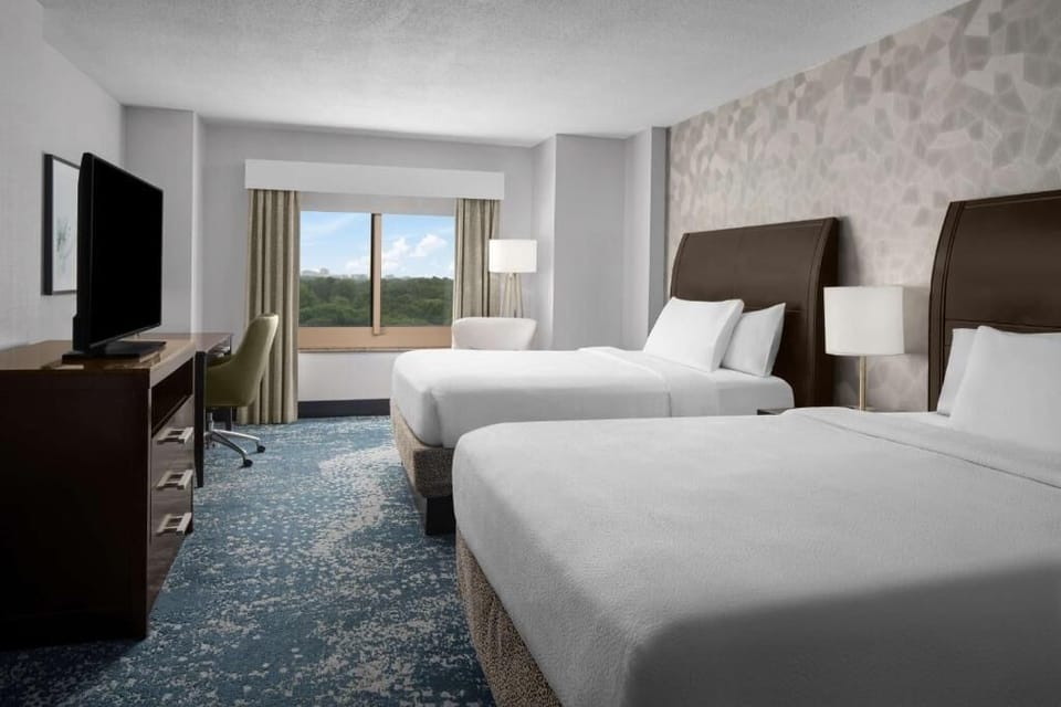 Settle into crisp linens and enjoy a roomy, restful layout.