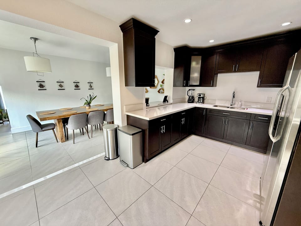 The Kitchen is fully stocked and connects to both the Living and Dining Rooms.