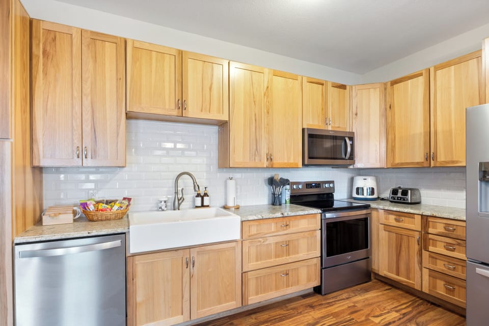 Fully stocked kitchen with full size appliances, kid friendly dishes, toaster, air fryer (must have for our family!), and all essentials. Check out the charging station for your devices and welcome basket with complimentary snacks.