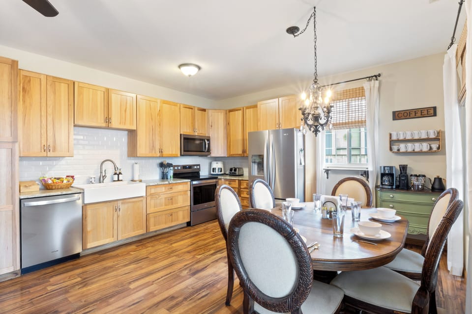 Open concept main floor includes the kitchen, dining area, and coffee station. 