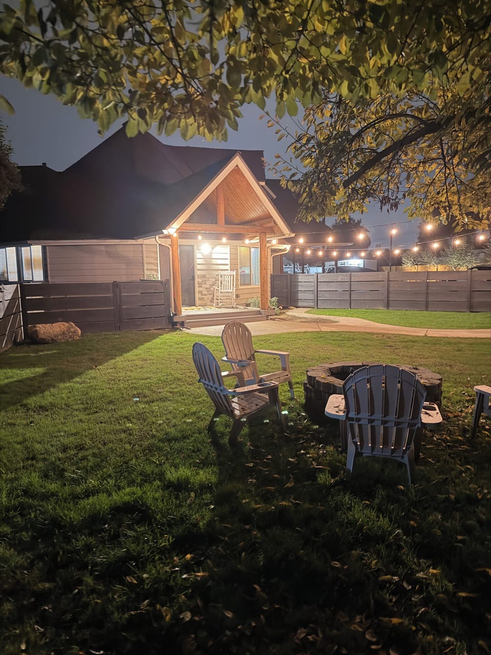 Private fenced front yard with firepit. 