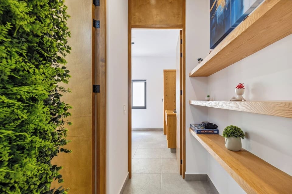 Nature wall hallway with board games, books and more.