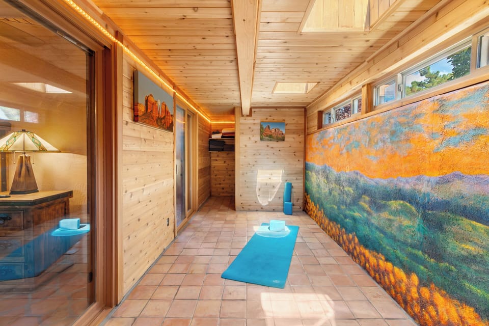 How about some yoga in this enclosed bonus room right off the primary suite.