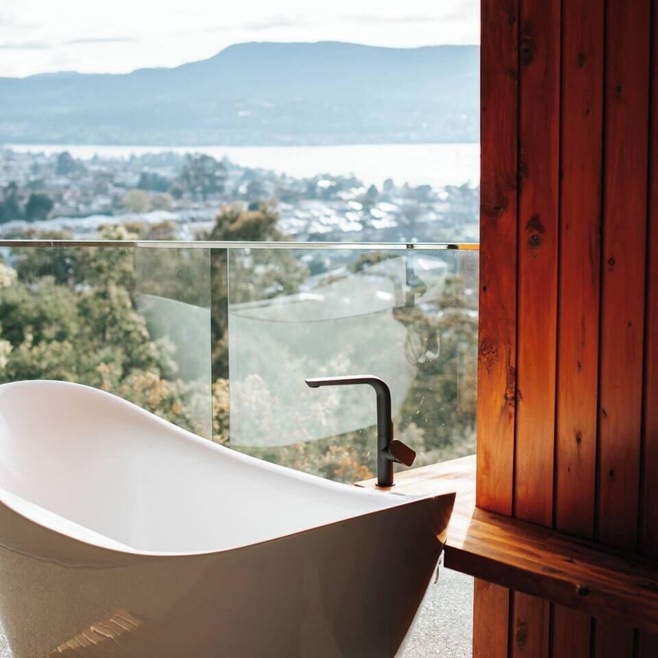 Private bath deck with views of the Derwent River and the mountains beyond.
