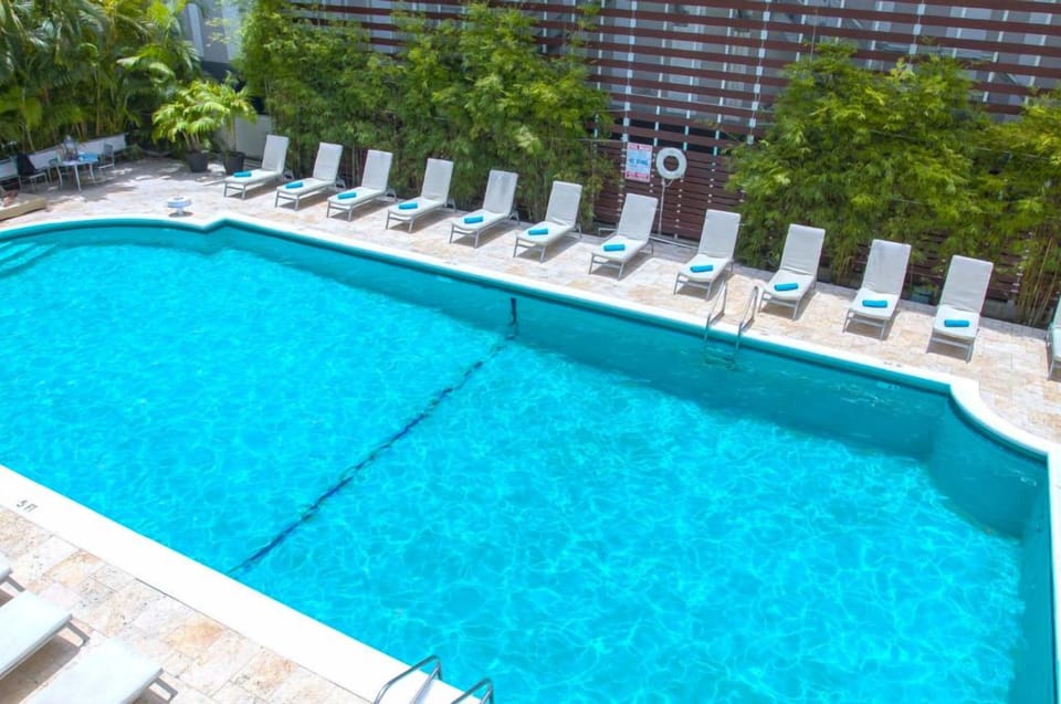 Dive into a sparkling pool and lounge under tropical palms.