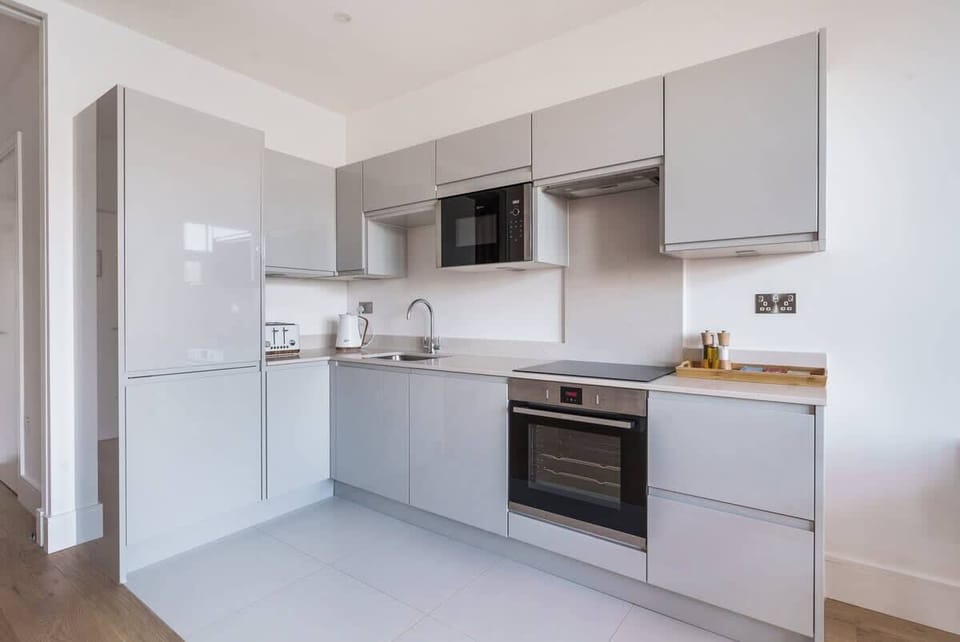 The streamlined kitchen comes fully equipped with everything you need.