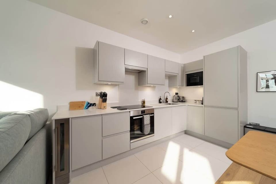 The modern kitchen comes fully equipped with everything you need.