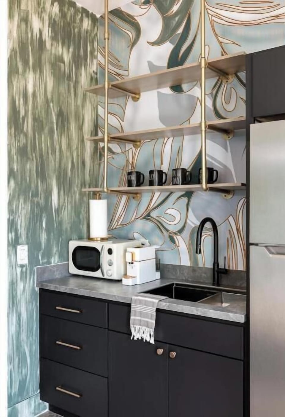 Casita Kitchenette has a microwave, coffee bar, sink and refrigerator.