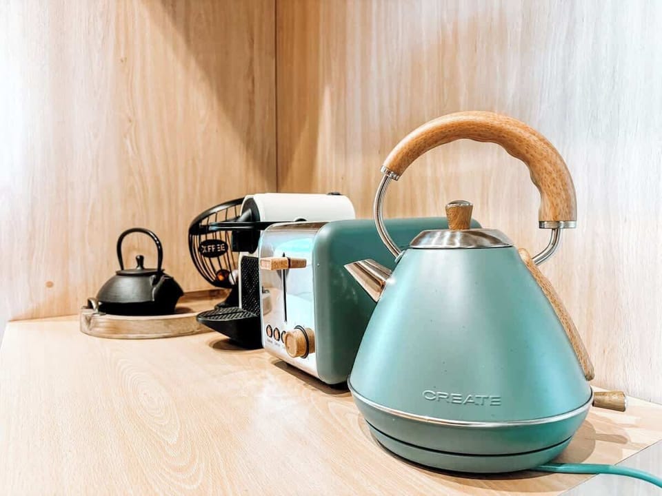 Coffee and tea maker, toaster and small fridge available in room