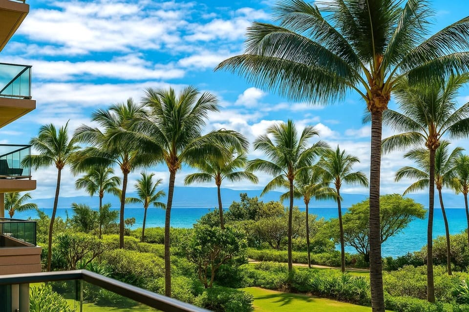 Swaying palms and a peek at the Pacific create a tranquil backdrop from your private Maui balcony retreat   HKK-234
