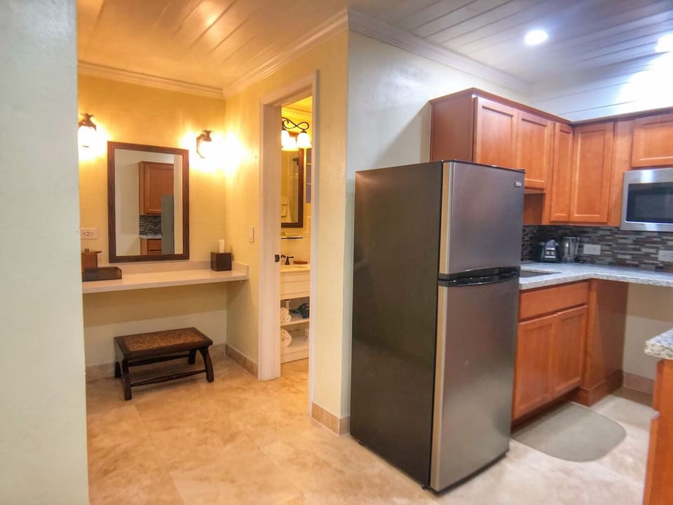 Whip up easy meals in a tidy, well-equipped kitchen nook.
