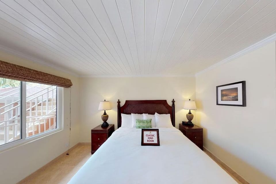 Relax into a serene king bed with soft, warm lamps.