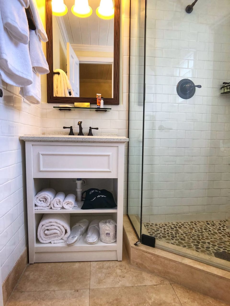 Pamper yourself with fluffy towels and bright vanity lighting.