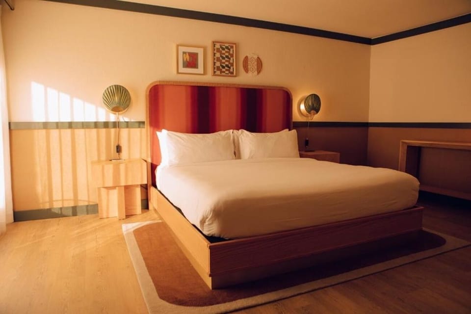 Unwind into crisp linens as golden-hour light fills the room.