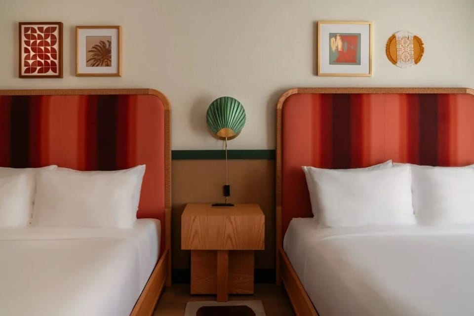 Settle in together with two cozy beds and warm design.