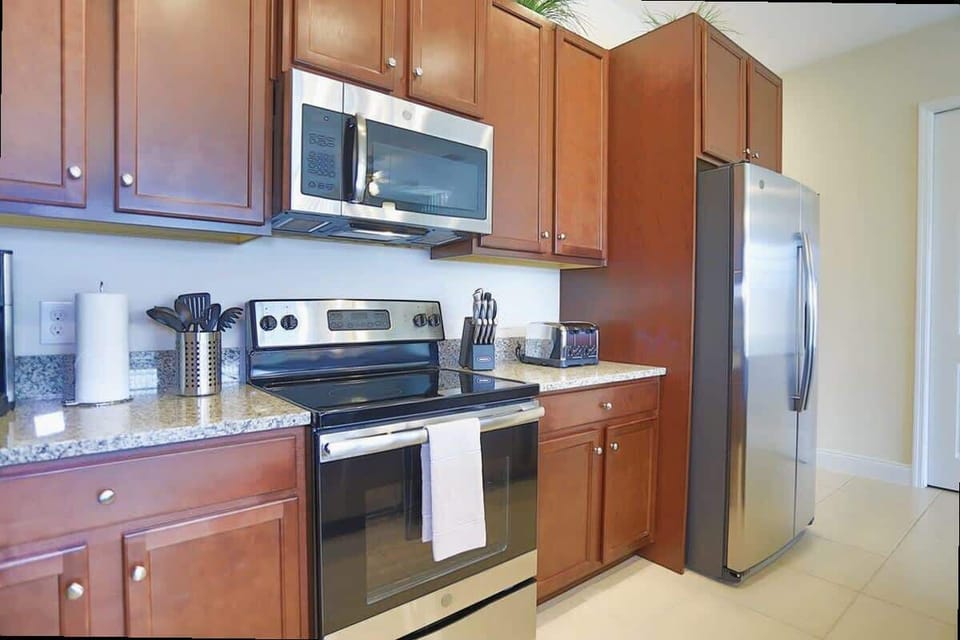 Whip up delicious meals in a fully equipped kitchen featuring sleek stainless steel appliances and granite countertops.