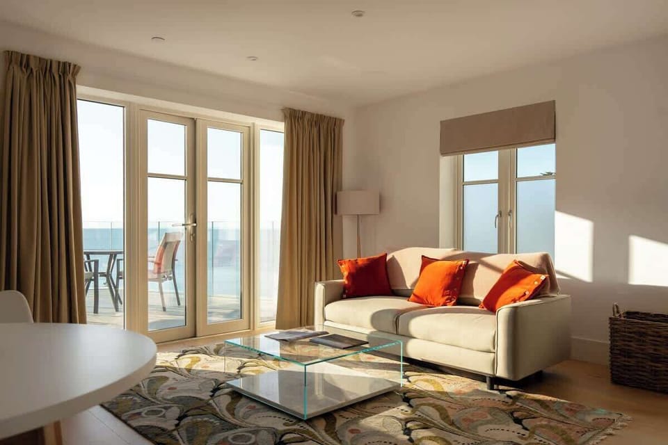 Relax and unwind in this stunning living room with breathtaking sea views, where every moment feels like a getaway.