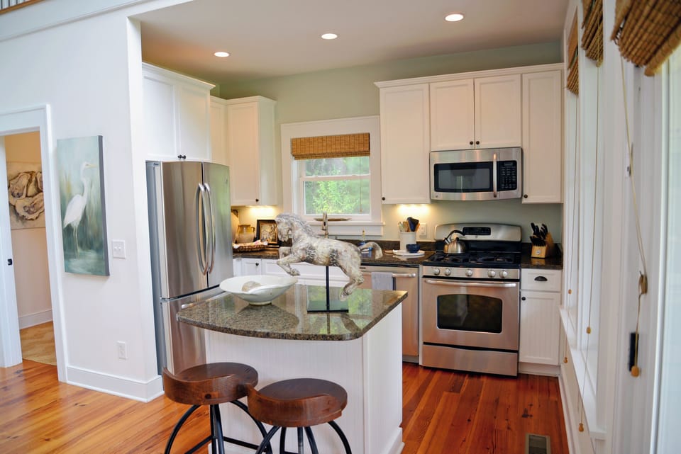 Kitchen with full set of stainless steel appliances including dishwasher