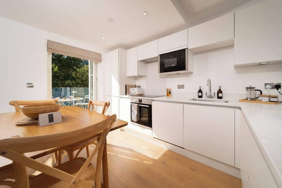 Dine in style in this modern dining room, where breathtaking views create the perfect backdrop for every meal.