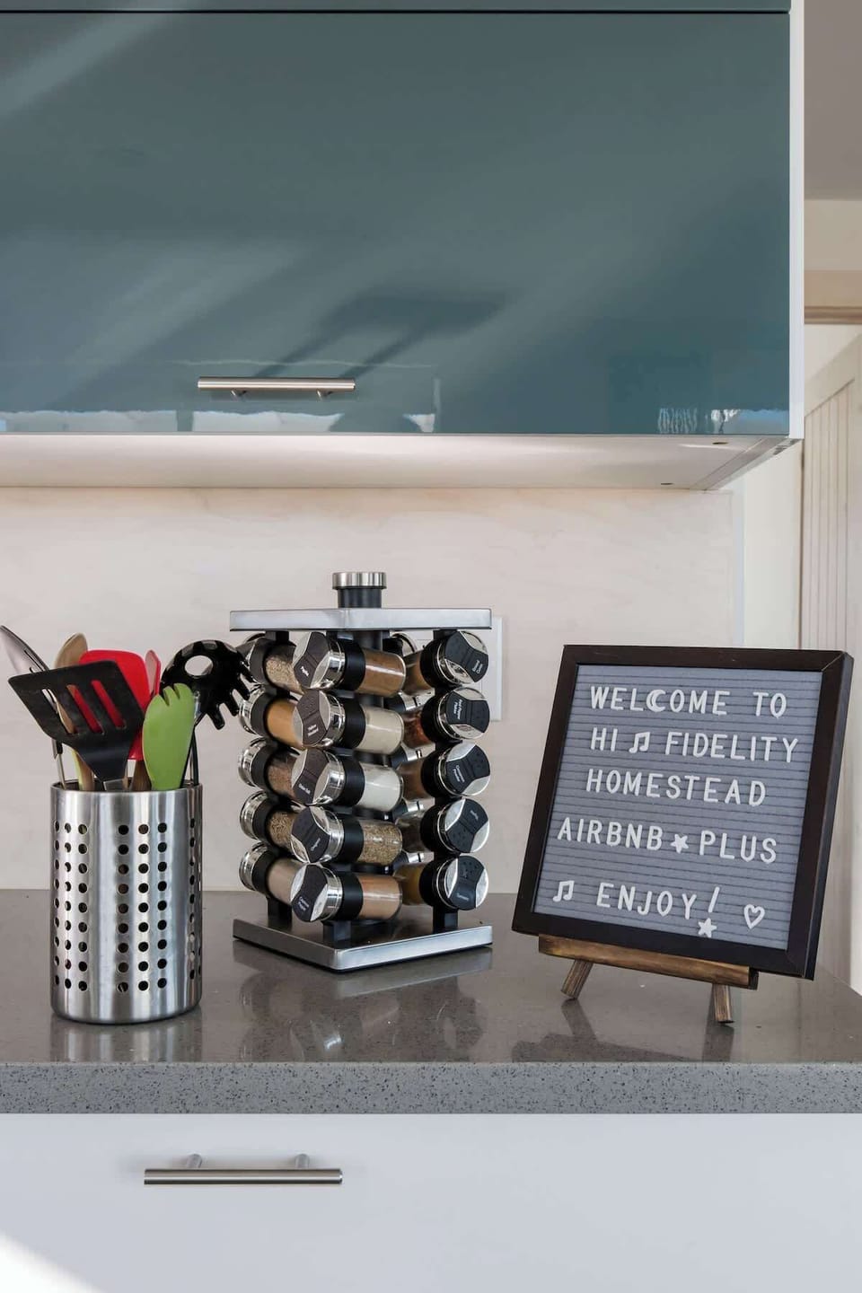 Spice rack and plenty of cooking utensils to prepare a great meal