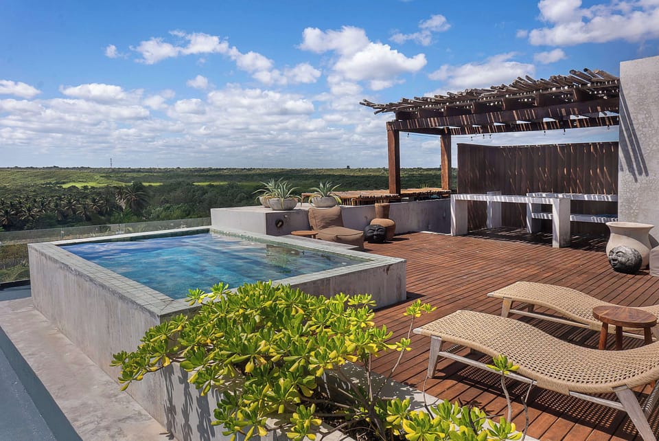 Exclusive private rooftop with sunbeds and stunning beach views — the perfect spot to relax and unwind.