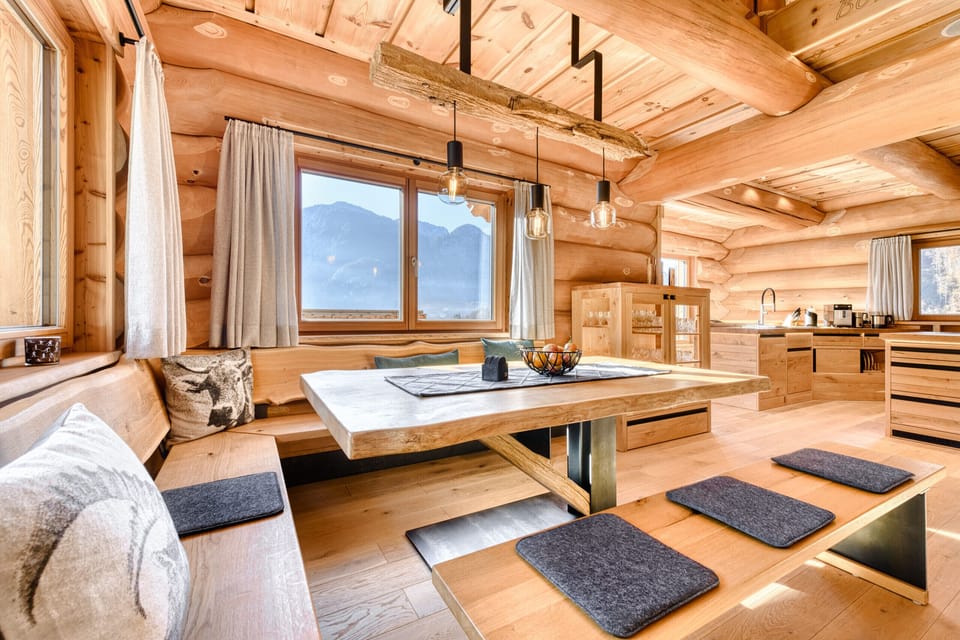 Chalet Bomhüsle in Dalaas in the Klostertal valley with a large dining table.