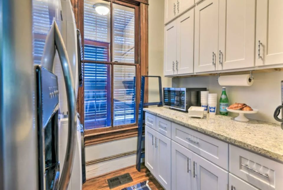 Bright kitchen with granite counters and modern appliances
