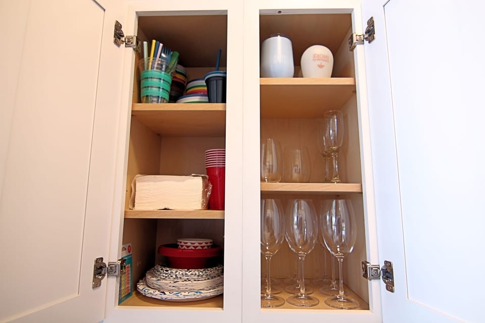 Fully stocked kitchen with glassware and dining essentials
