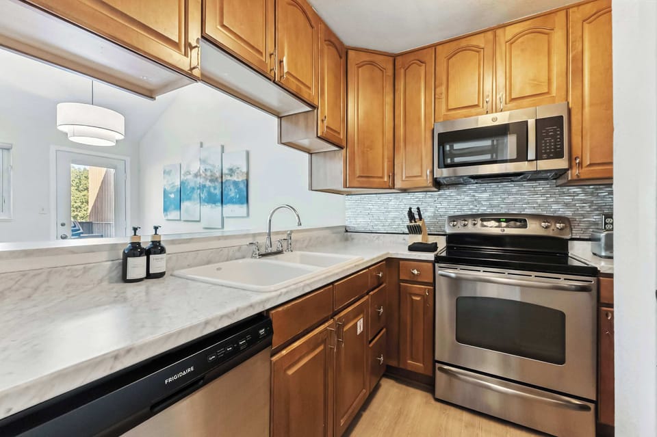 Kitchen: Main floor, drip coffee maker, toaster, cooking utensils, tableware