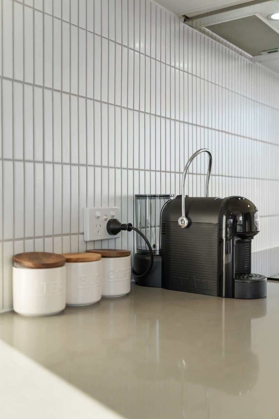 Lavazza capsule coffee machine with complimentary pods—tea and sugar also provided.