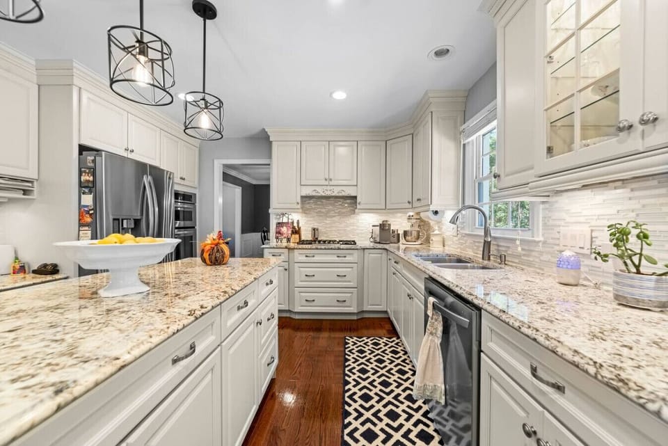 Spacious, updated modern kitchen with island and dining area.