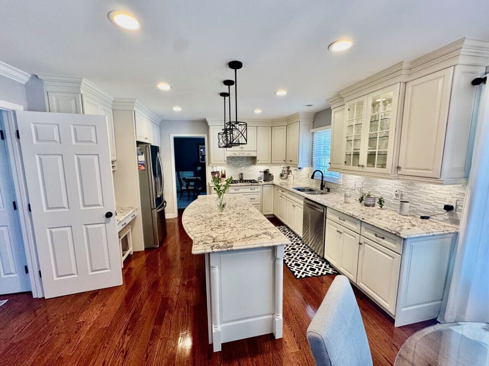 Spacious, updated modern kitchen with island and dining area.