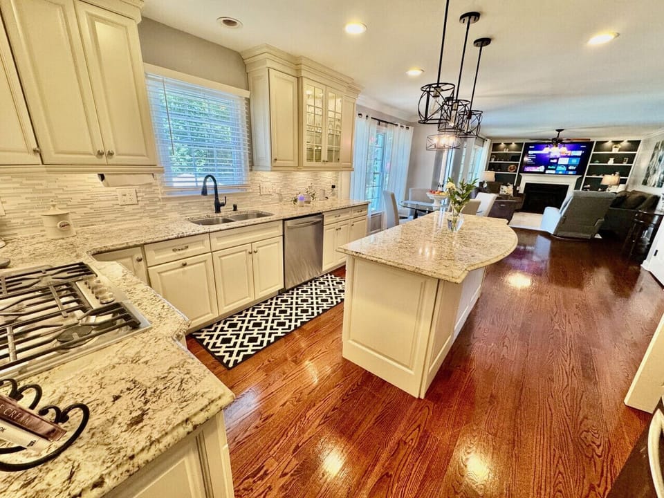 Spacious, updated modern kitchen with island and dining area.