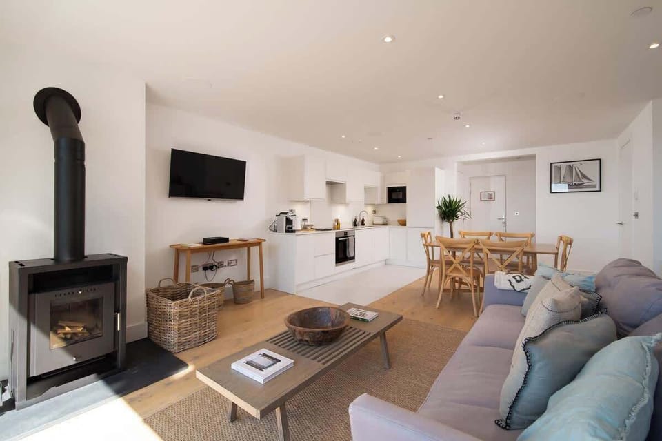 Experience the expansive elegance of our open-plan living room, which is built for comfort and easy relaxation in the centre of your stay.