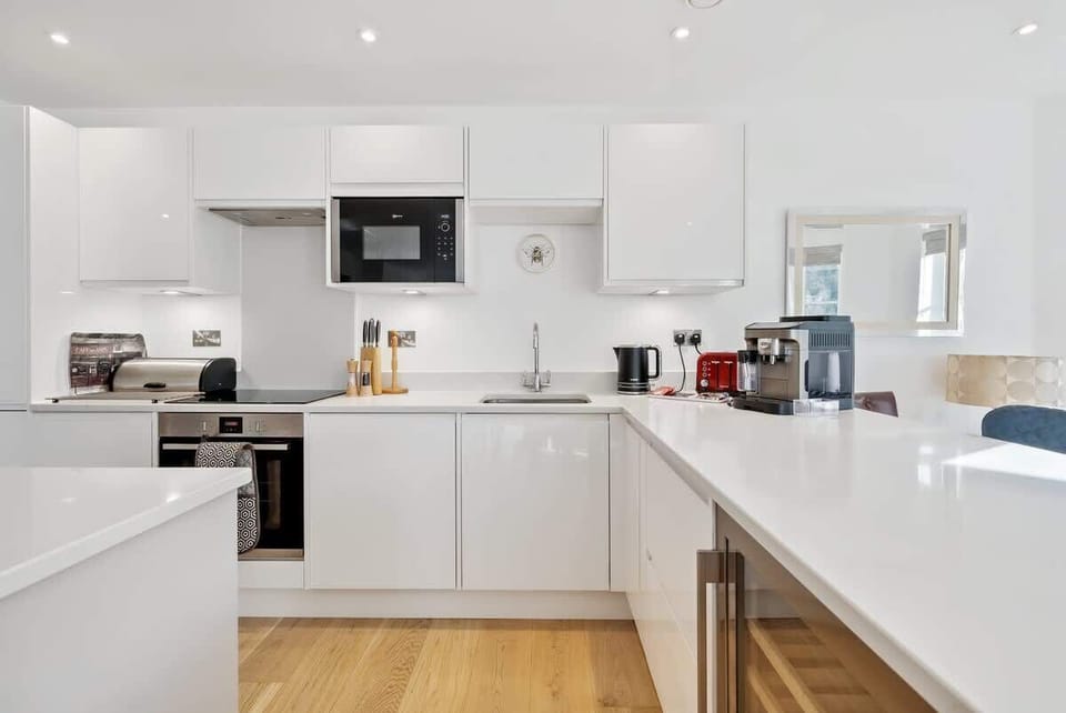 Experience a sleek, modern kitchen fully equipped with everything you need for a comfortable and effortless stay.