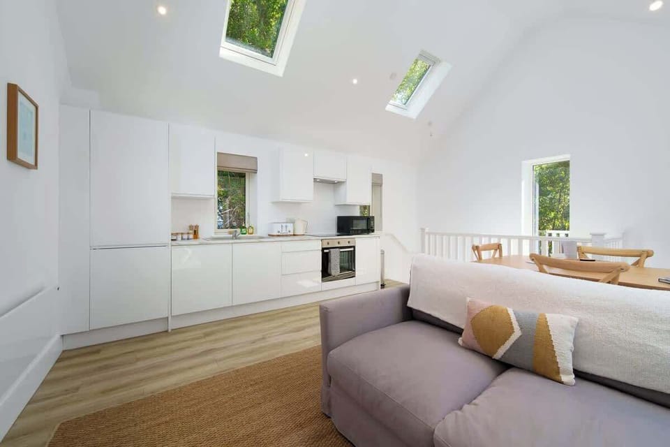 Enjoy cooking and socialising in the sleek, modern open-plan kitchen, fully equipped for effortless holiday living.
