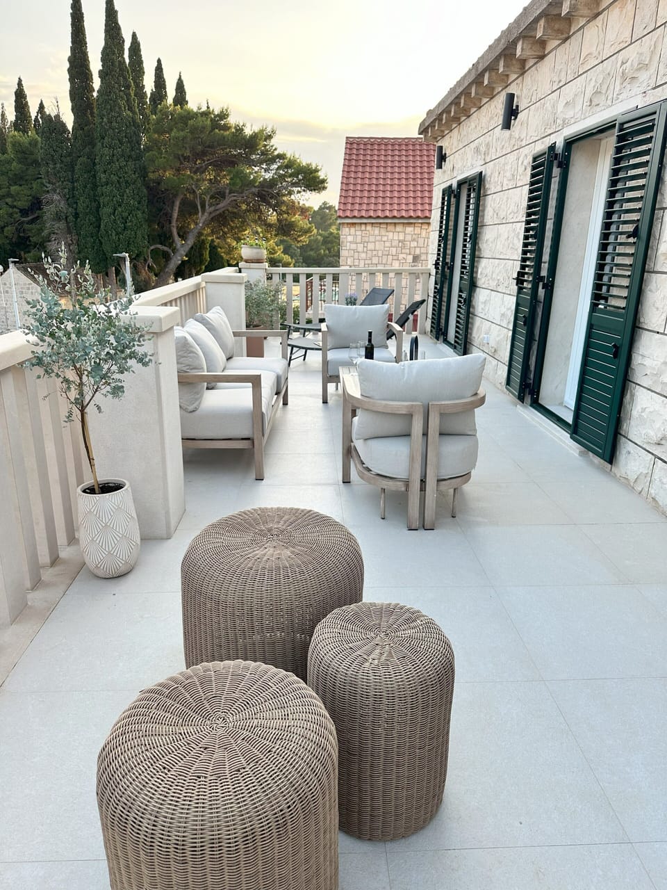 Large terrace equipped with sun beds and couches for excellent outdoor living