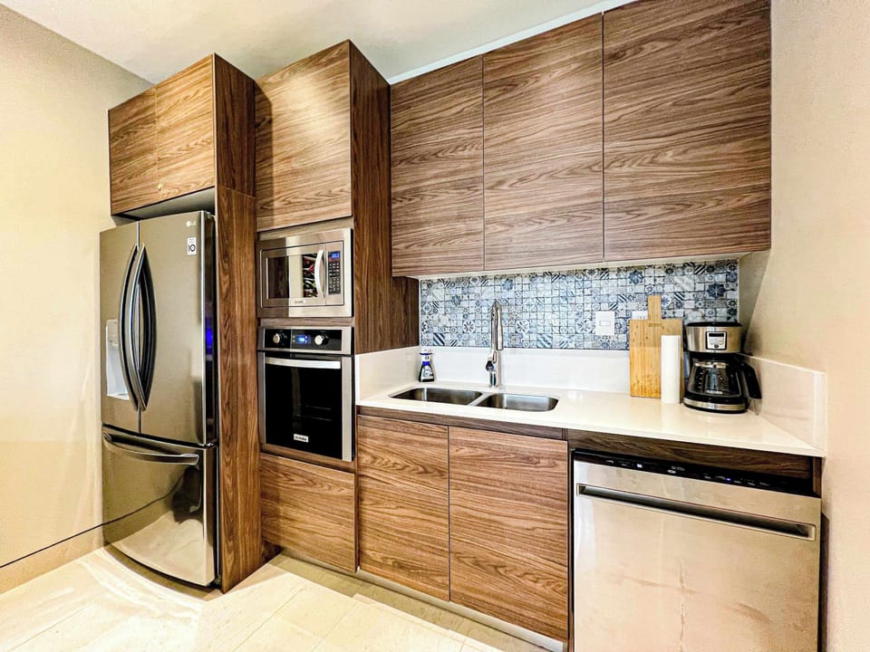 Modern kitchen, fully equipped for culinary adventures.