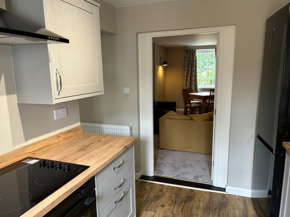 Kitchen looking into lounge