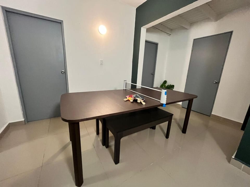 Versatile indoor space with a stylish twist—enjoy dining, working, or a spontaneous ping pong match in this modern, multi-functional table