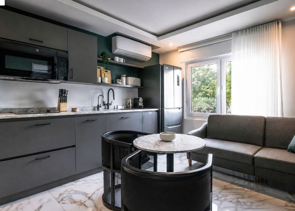 Apartment style king bedroom with  sofa bed, dining area and kitchem