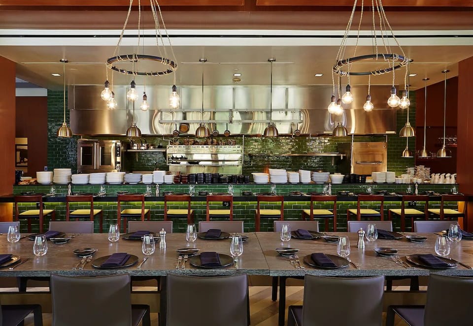 Savor chef-crafted flavors beside the lively open kitchen.